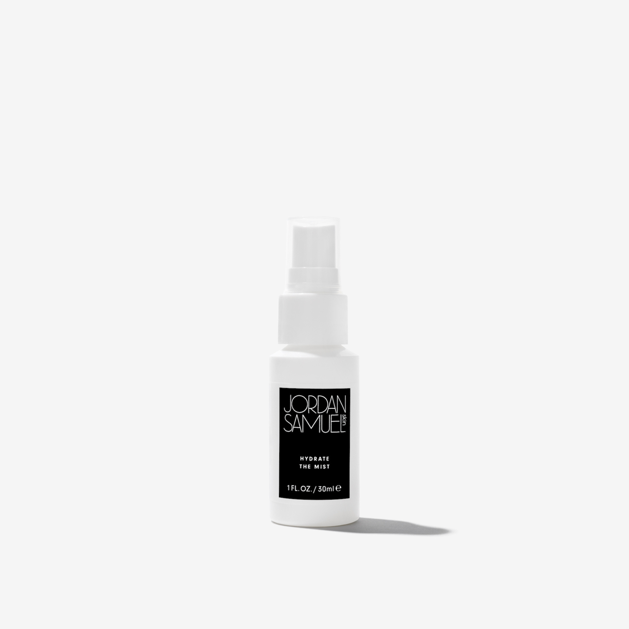 Hydrate the Mist Mini product photo - White spray bottle with black label on a white background